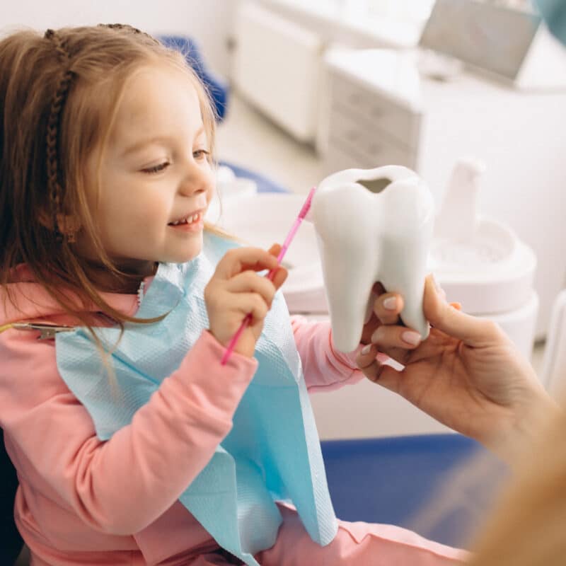 OPDSF Help your child overcome dental anxiety, little girl at dentist's office